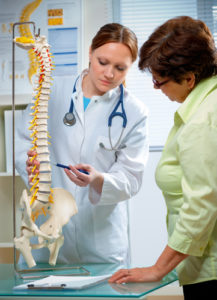 Chiropractor Explaining about Back Pain Relief